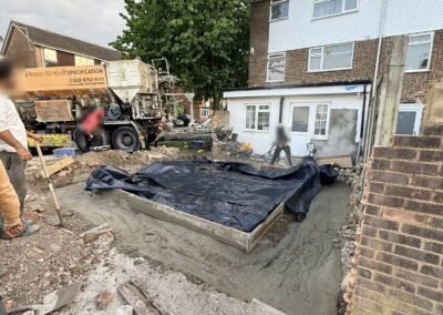 Concrete floor slab being poured for a new extension
