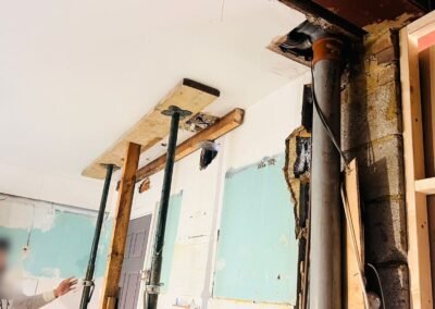 Acrow props and strongboy supporting the structure during a knock-through