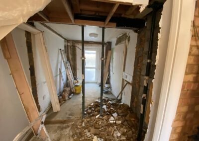 New steel beam installed above a knock-through opening